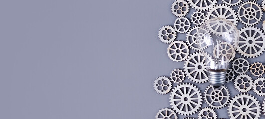 Light Bulb and Wooden Gears: Symbolizing Innovation, Complex Ideas, and Engineering Solutions