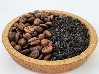 Whole bean coffee and tea infusions close up. Coffee or tea beans