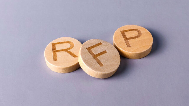 RFP (Request for Proposal) Concept: Wooden Blocks Representing Business Bidding and Procurement