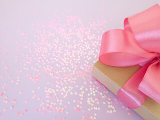 A gift for a woman on February 14, March 8, minimalism, copyspace, love, pink background, heart, Valentine's Day
