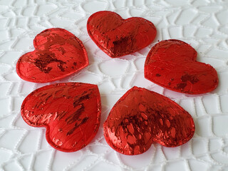 Red hearts on a white openwork background, love, heart, valentine's day, february 14, copyspace