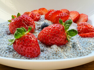 Healthy breakfast, beautiful dessert, chia pudding with strawberries and berries