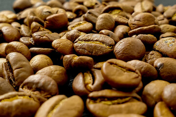 Coffee beans, natural textured brown background, morning espresso drink