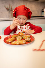 Child decorating cookies in a cozy kitchen during a festive baking session