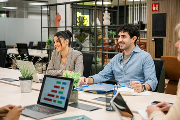 Diverse professionals collaborating during a business meeting in modern office