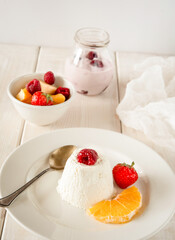 Ice cream with berries in white plate