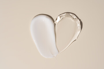 Soothe cream lotion moisturizer gel smears on beige background. Skincare and body beauty product. Liquid gel cosmetic smudges