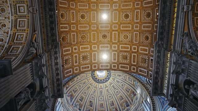 Interior view of ceiling and dome of Saint Peter's Basilica in Vatican city, Rome, Italy