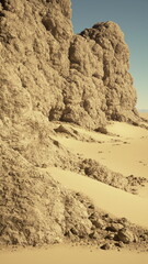 A harsh desert landscape dominated by rocks and sand under the scorching sun.