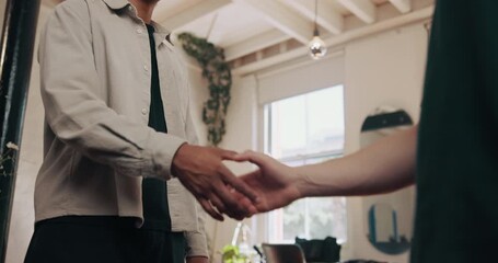 Below, men and handshake with barber at hair salon for welcome, introduction and service deal. People, shaking hands and respect for customer appreciation, haircut agreement and grooming appointment
