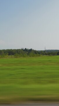 sunny day time green harvest field landscape road trip passenger side window pov vertical panorama 4k