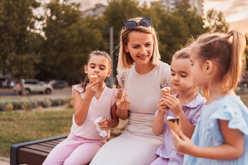 Happy family enjoying a summer day eating ice cream