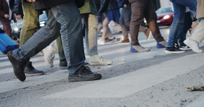 Crowd people walking on urban street road crossing  at busy intersection in Rome, Italy, slow motion