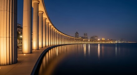 Warmly lit classical colonnade curving along an urban waterfront at twilight, with dramatic reflections on the dark water.