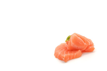 Sashimi made from salmon and wasabi on a white background. Japanese style food.