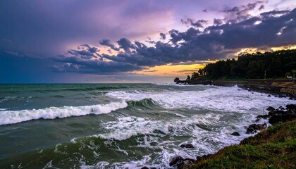 The image captures a dramatic seascape with turbulent waves crashing against a rocky
