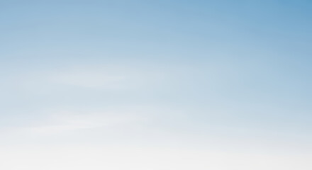 A Serene Gradient of Blue Fading Into a Pure White Sky Backdrop