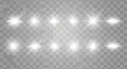 Fototapeta premium Collection of sparkling white lens flares on a transparent background for design