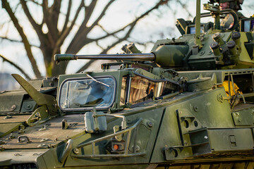NATO armored combat vehicle with reinforced turret and forward weapon system underscoring alliance ground strength and protective military posture in current geopolitical climate