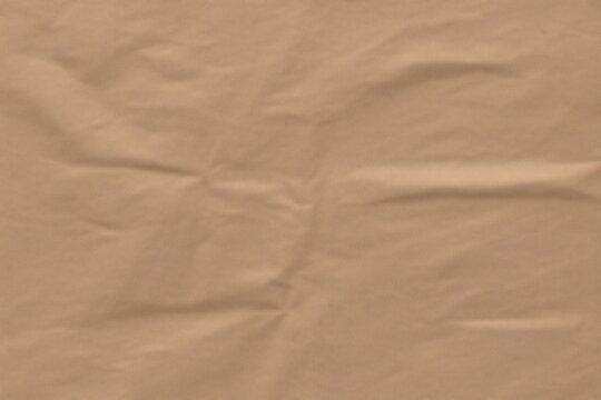 Wrinkled paper with a light brown texture. The texture is smooth and soft, showing the marks of wear and tear