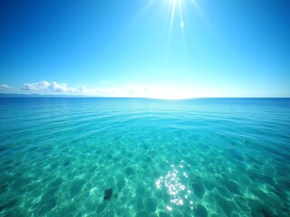 Vibrant blue ocean water under a bright sun, with clear shallows revealing the seabed.