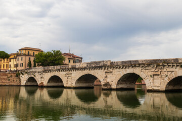 Naklejka premium The Bridge of Tiberius over the Marecchia river in Rimini, Italy