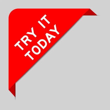 Red color of corner label banner with word try it today on gray background