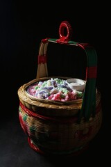 Khanom Leb Meu Nang,traditional Thai dessert known for its vibrant colors and distinct shape.
