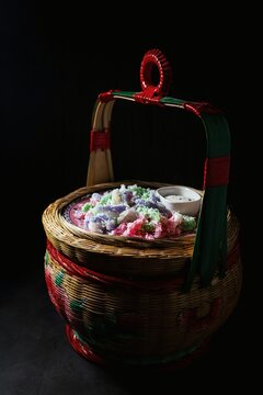Khanom Leb Meu Nang,traditional Thai dessert known for its vibrant colors and distinct shape.