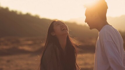 Joyful laughter as a young couple shares a sunny moment, golden hour romance and authentic connection, perfect for travel, lifestyle, or relationship content
