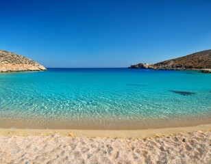 Fototapeta premium pristine sandy shore and transparent waters at a charming island beach in the southern part of the small cyclades