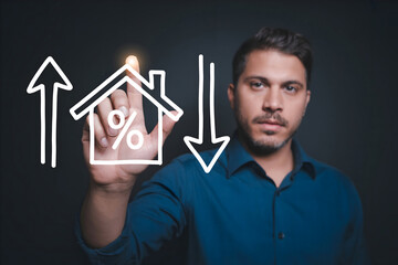 Man in blue shirt interacting with house price and interest rate graphics on a transparent screen
