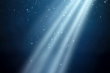 Gentle light rays with magic floating snow. Winter night background with snowflakes. Blue magic lighting scene.