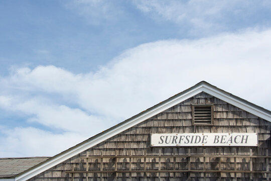 Surfside Beach sign on wooden building
