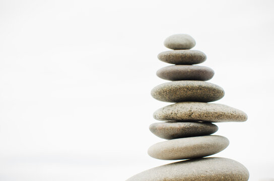 Close-up of cairn by lake