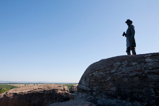 Silhouette of General G. K. Warren statue at Little Round Top