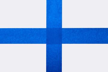 Strips of blue tape on white background