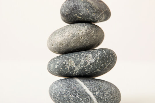 Stack of gray stones on white background