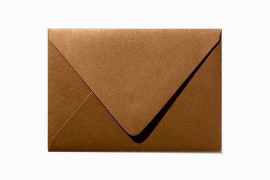Gold blank envelope on white background