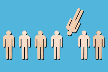 Wooden cutouts of people on blue background