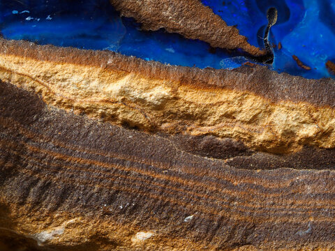 Magnified view of surface of piece of Australian boulder opal