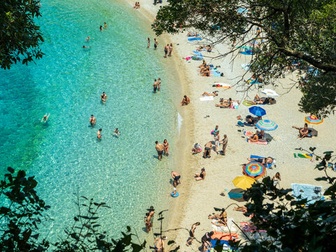 Overhead view of people swimming and sunbathing at Rovinia Beach