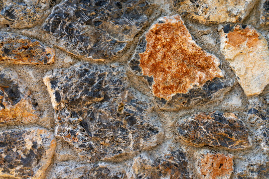 Close-up of gray and brown cobblestone wall
