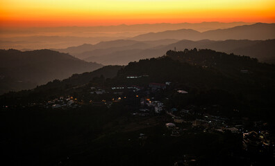 A mountain range with a town at the bottom Doi maesalong, Chiang rai,thailand