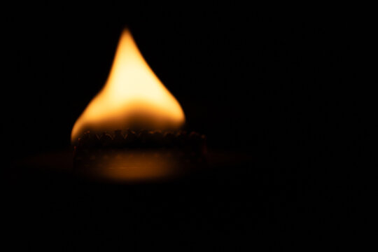 burning match on black background - Powered by Adobe