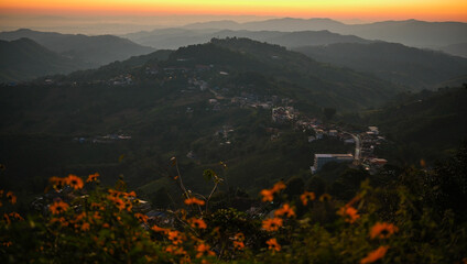 A mountain range with a town below Doi maesalong, Chiang rai,thailand