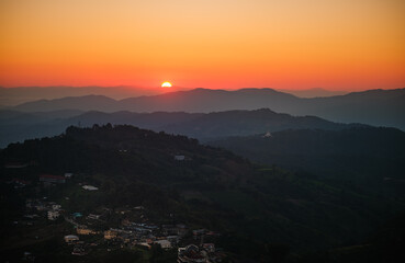 A mountain range with a sunset in the background Doi maesalong, Chiang rai,thailand