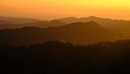 A mountain range with a sunset in the background Doi maesalong, Chiang rai,thailand