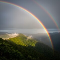 Rainbow over Mountain: A vibrant double rainbow arches gracefully over a stunning vista of rolling green hills and valleys, illuminated by a gentle ray of sunlight after a storm. 