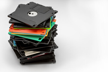 Stack of 3.5" Floppy disk on white background , Retro digital storage technology